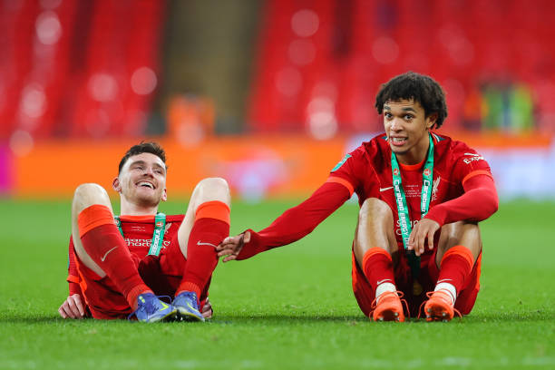 Trent Alexander-Arnold and Andrew Robertson of Liverpool sit and look on after the Carabao Cup Final match between Chelsea and Liverpool at Wembley...