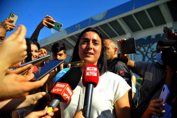 Tunisian tennis player Ons Jabeur talking to journalists after her return to the capital Tunis from Wimbeldon, on July 13, 2022. Hailing her as the...