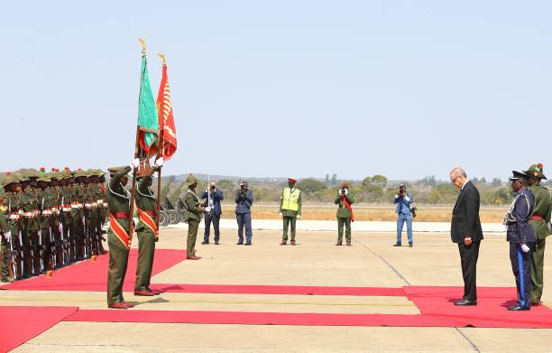 Turkish President Recep Tayyip Erdogan inspects the honour guards as he is being welcomed by Zambian President Edgar Lungu with an official welcoming...