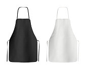 Two blank black and white aprons