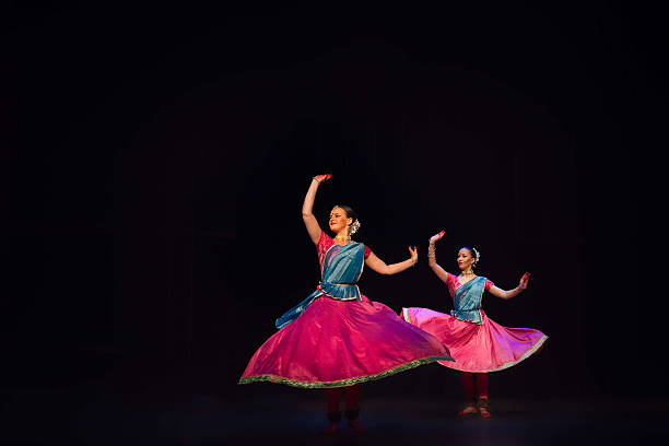 Two dancers performing Kathak, an Indian traditional dance, in New Delhi, India.