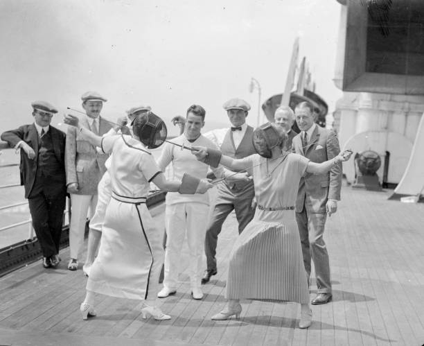 Two female passengers on the Cunard liner Berengaria take part in a ladies' fencing match.