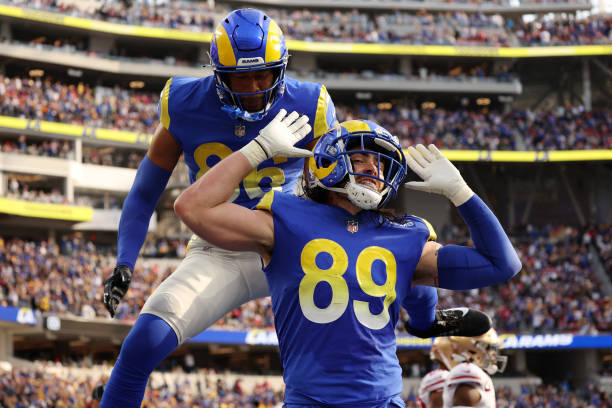 Tyler Higbee of the Los Angeles Rams celebrates after making a catch for a touchdown with Kendall Blanton in the second quarter of the game against...