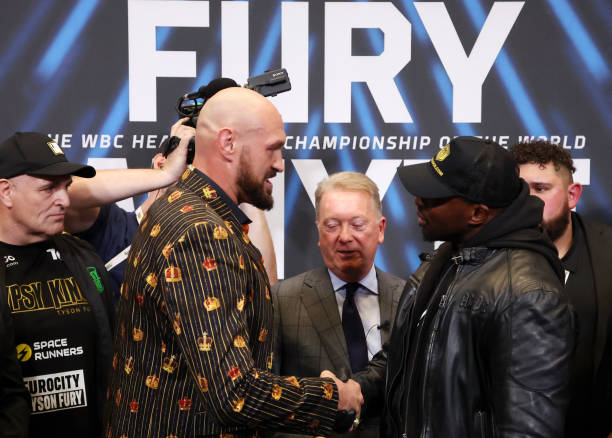Tyson Fury and Dillian Whyte shake hands during a press conference ahead of the heavyweight boxing match between Tyson Fury and Dillian Whyte at...
