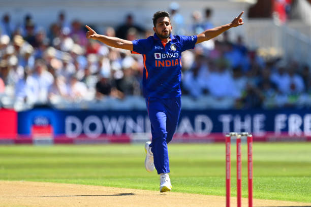 Umran Malik of India celebrates taking the wicket of Jason Roy of England during the 3rd Vitality IT20 match between England and India at Trent...