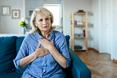 Upset stressed older woman feeling heartache