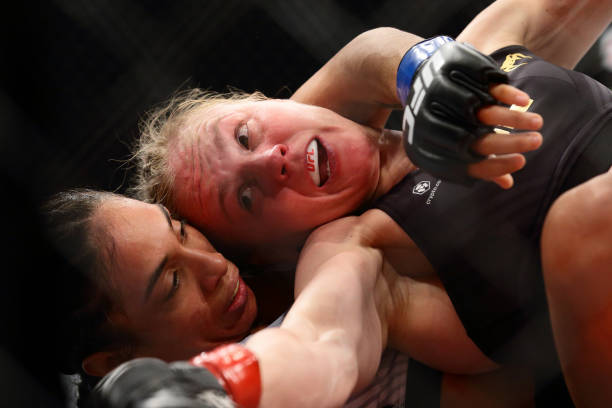Valentina Shevchenko of Kyrgyzstan battles Taila Santos of Brazil in the womens strawweight title bout during the UFC 275 event at Singapore Indoor...