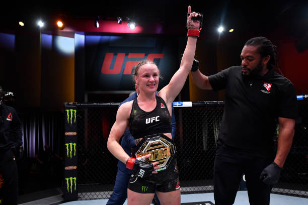 Valentina Shevchenko of Kyrgyzstan celebrates her victory over Jennifer Maia of Brazil in their women's flyweight championship bout during the UFC...