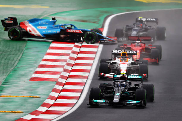 Valtteri Bottas of Finland driving the Mercedes AMG Petronas F1 Team Mercedes W12 leads Max Verstappen of the Netherlands driving the Red Bull Racing...