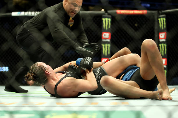 Vanessa Demopoulos puts Silvana Gomez Juarez of Argentina in an arm bar in their strawweight fight during the UFC 270 event at Honda Center on...