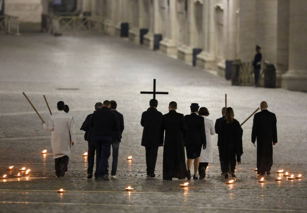 Vatican City, VATICAN, APRIL 10: Celebrants walk in St. Peter's Square during the rehearsal of the Via Crucis torchlight procession presided by Pope...