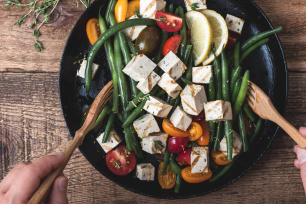 vegan meal, cooking green beans salad with grilled tofu - iron in meal stock pictures, royalty-free photos & images