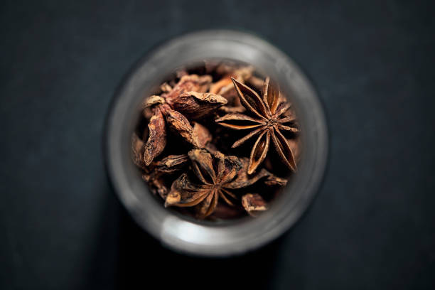 view from above star anise in spice jar - star anise stock pictures, royalty-free photos & images