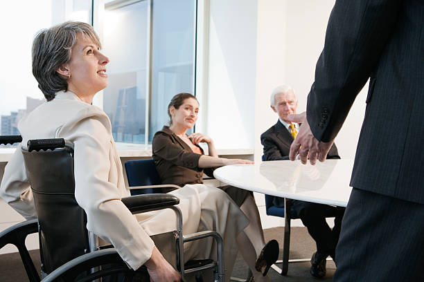 View of businesspeople sitting in an office