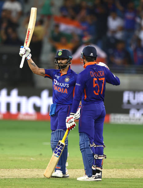 Virat Kohli of India is congratulated by Deepak Hooda of India after reaching his half century during the DP World Asia Cup match between India and...