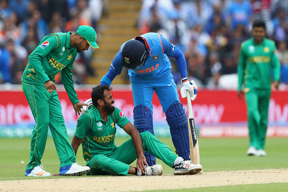 Image result for Wahab Riaz suffered a tournament-ending ankle injury during Pakistan's crushing 124-run defeat  against India