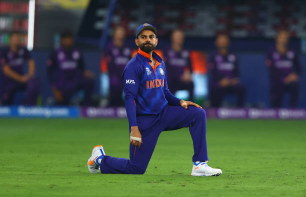 Virat Kolhi of India takes the knee during the ICC Men's T20 World Cup match between India and Scotland at Dubai International Cricket Ground on...