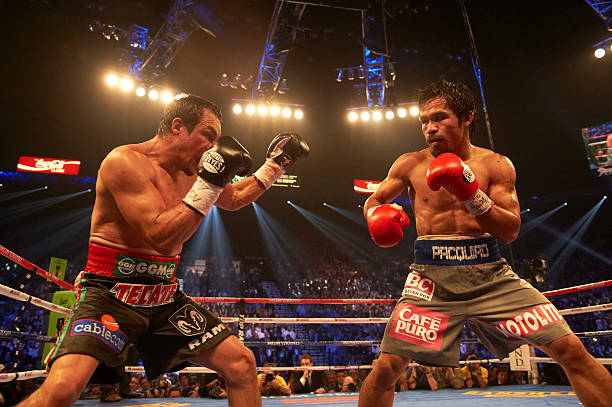 welterweight-boxing-manny-pacquiao-in-action-vs-juan-manuel-marquez-picture-id158335003