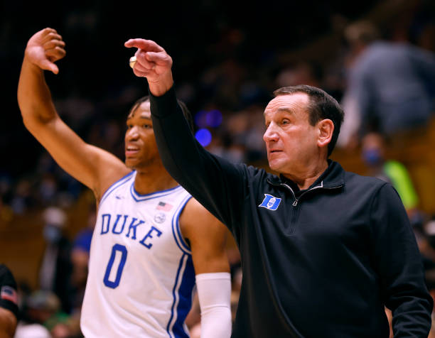 Wendell Moore Jr. #0 and head coach Mike Krzyzewski of the Duke Blue Devils set the offense during the second half of their game against the Gardner...