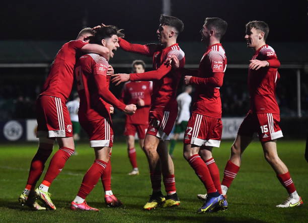 Wicklow , Ireland - 18 February 2022; Ruairi Keating of Cork City, second from left, celebrates after scoring his side's sixth goal during the SSE...