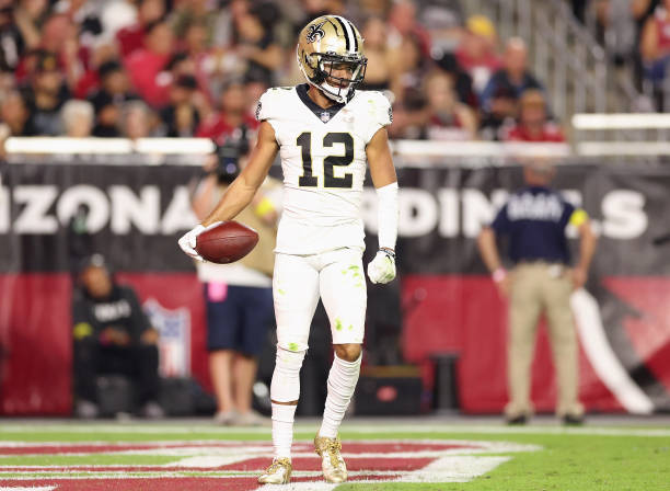 Wide receiver Chris Olave of the New Orleans Saints reacts after a reception against the Arizona Cardinalsduring the NFL game at State Farm Stadium...