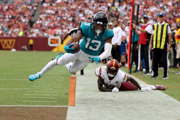 Wide receiver Christian Kirk of the Jacksonville Jaguars cannot score a touchdown as he dives for the endzone against the Washington Commanders...