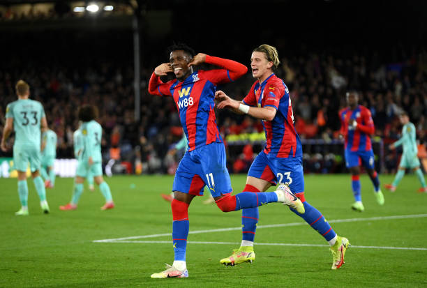 Wilfried Zaha of Crystal Palace celebrates with Conor Gallagher after scoring their team's first goal during the Premier League match between Crystal...