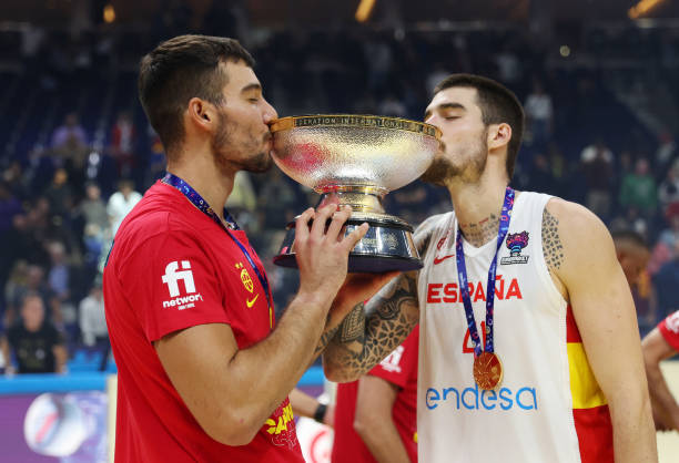 Willy Hernangomez and Juancho Hernangomez of Spain kiss The Nikolai Semashko Trophy following their side's victory in the FIBA EuroBasket 2022 final...