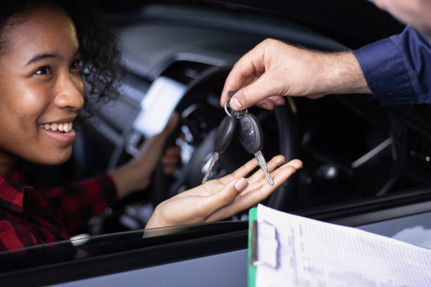 Woman being handed car key