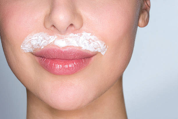 depilatory cream on woman's upper lip