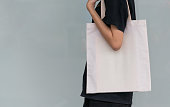 woman carry bag on nature background in save earth concept or say no plastic bag.