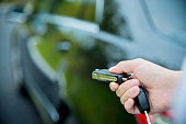 Woman hand unlocking a car