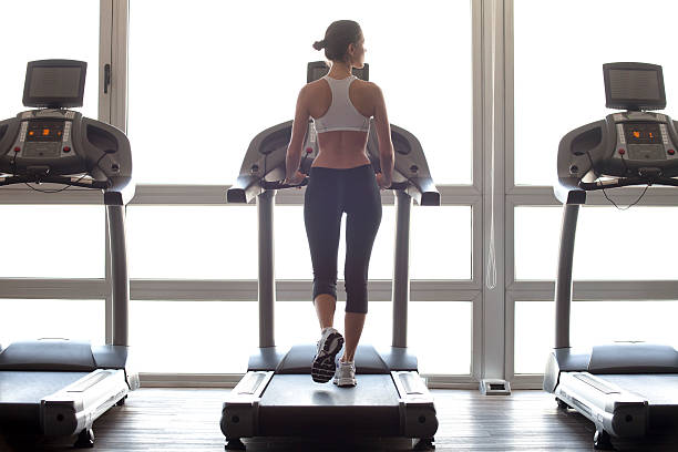 woman jogging on treadmill at gym picture