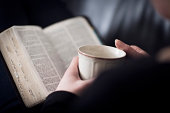Woman Read the Bible and Drink Tea or Coffee