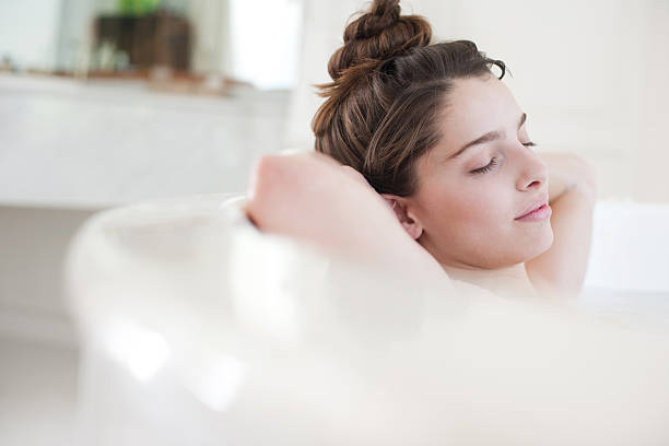 woman relaxing in bubble bath - take a bath stock pictures, royalty-free photos & images