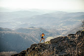 Woman running on mountain