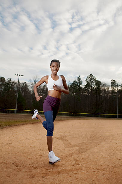 A woman warming up on a sports field
