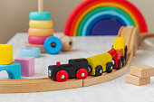 Wooden toy railway and pyramid in the children room