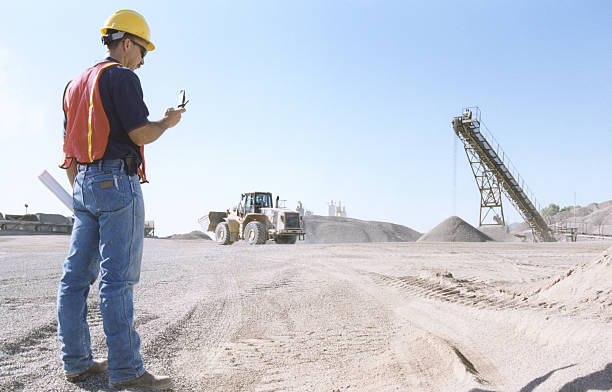 worker at construction site - construction wifi stock pictures, royalty-free photos & images