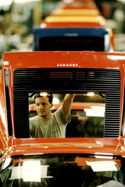 Worker works on the assembly line of the Ferrari Testarossa Pininfarina on May, 1990 in San Giorgio Canavese, Turin - Italy.