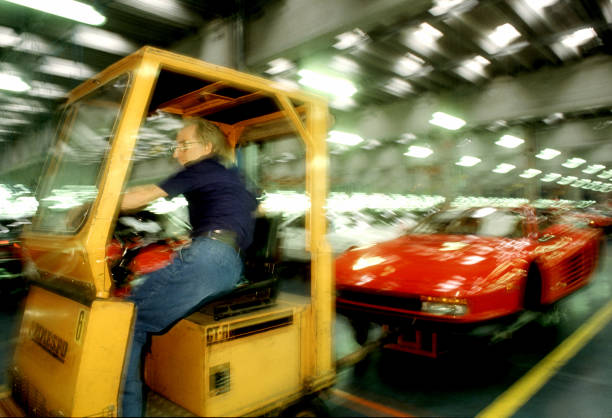 Worker works on the assembly line of the Ferrari Testarossa Pininfarina on May, 1990 in San Giorgio Canavese, Turin - Italy.