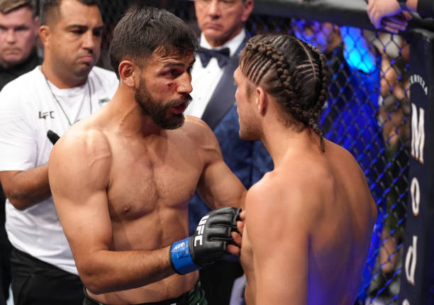 Yair Rodriguez of Mexico and Brian Ortega talk after their featherweight fight during the UFC Fight Night event at UBS Arena on July 16, 2022 in...