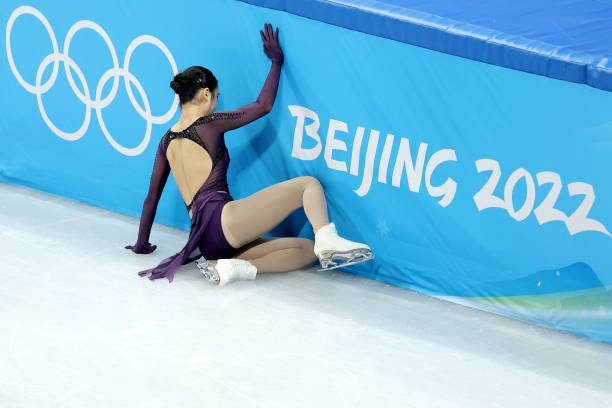 Yi Zhu of Team China falls during the Women Single Skating Short Program Team Event on day two of the Beijing 2022 Winter Olympic Games at Capital...