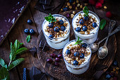 Yogurt with granola, berry fruits and chocolate
