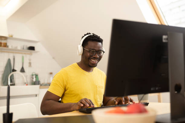 young african-american freelancing from home - black developer stock pictures, royalty-free photos & images