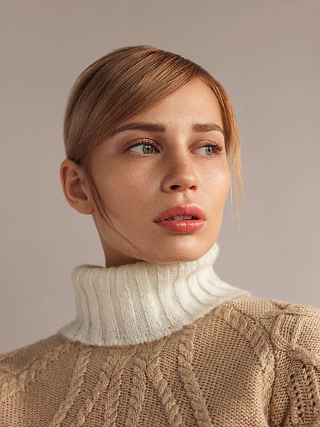 young beautiful woman in knitwear -  sweater stock pictures, royalty-free photos & images