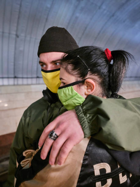 young couple in protective masks