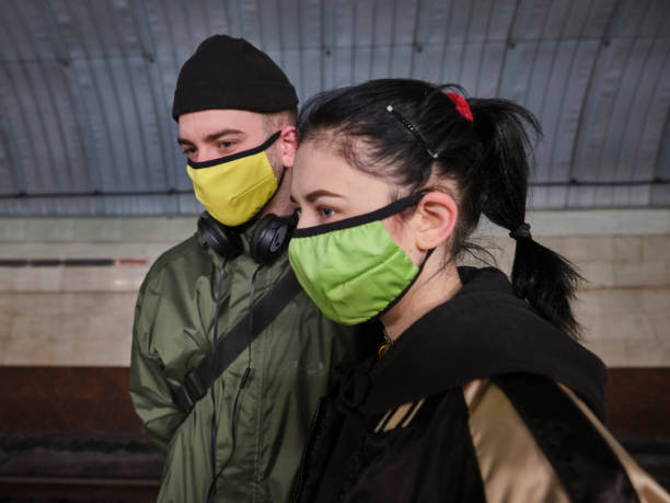 young couple in protective masks