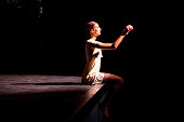 Young dancer performing on a theater stage