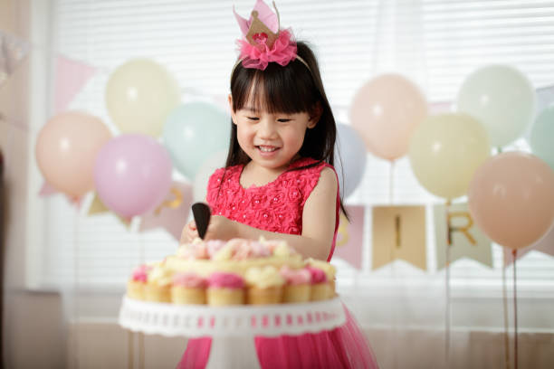 Young Girl Celebrating Her 5Th Birthday At Home